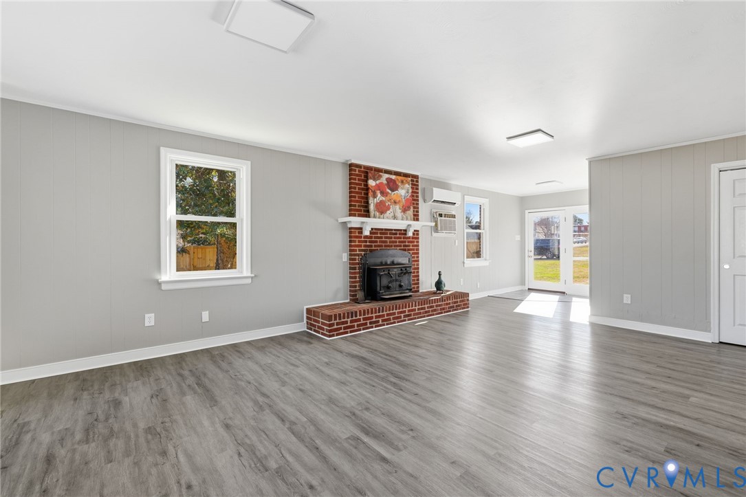 5607 Jahnke Road Richmond, VA 23225 - Photo 8 of 28 Unfurnished living room with wood finished floors,
