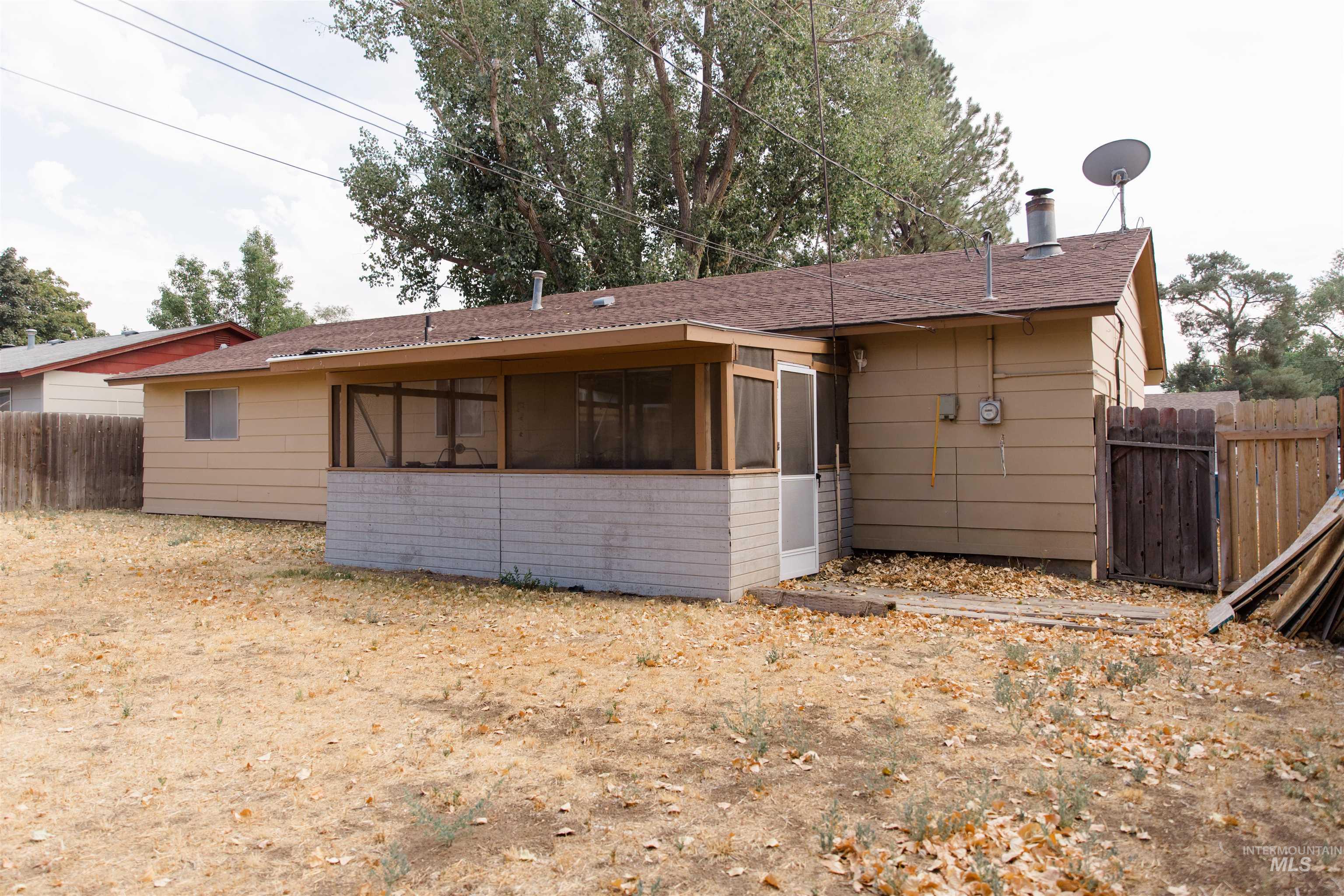 1230 East 17th North Mountain Home, ID 83647 - Photo 24 of 27 Enclosed screened porch with a durable composition shingle roof