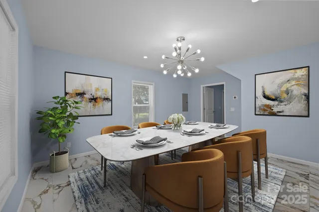 a view of a dining room with a table and chairs