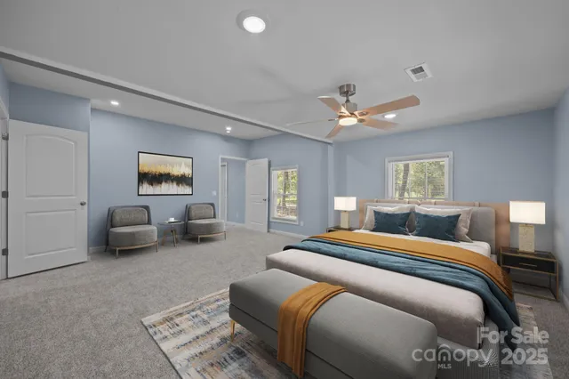 a bedroom with bed and a couch