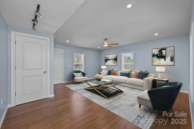 a living room with furniture or couch and a wooden floor