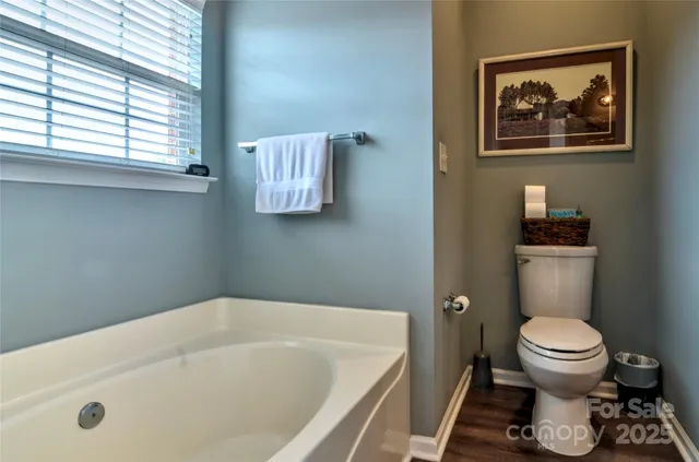 a bathroom with a toilet and a sink