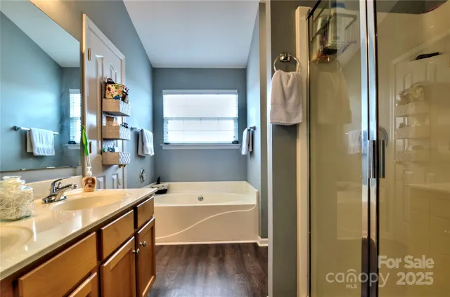 a bathroom with a tub and a sink