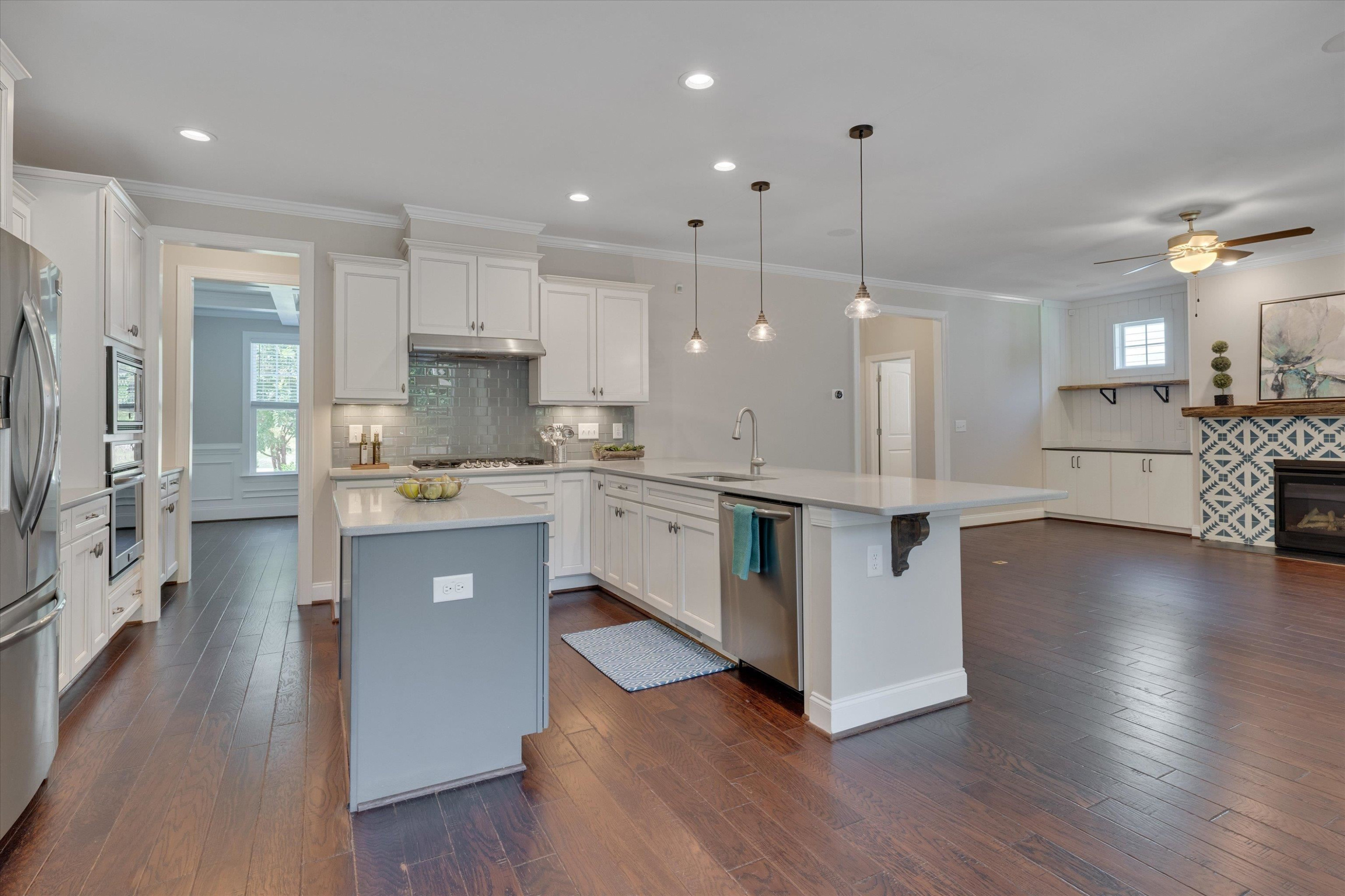 2617 Needle Pine Drive Apex, NC 27539 - Photo 11 of 42 a kitchen with stainless steel appliances granite countertop a refrigerator a sink dishwasher and a oven with wooden floor