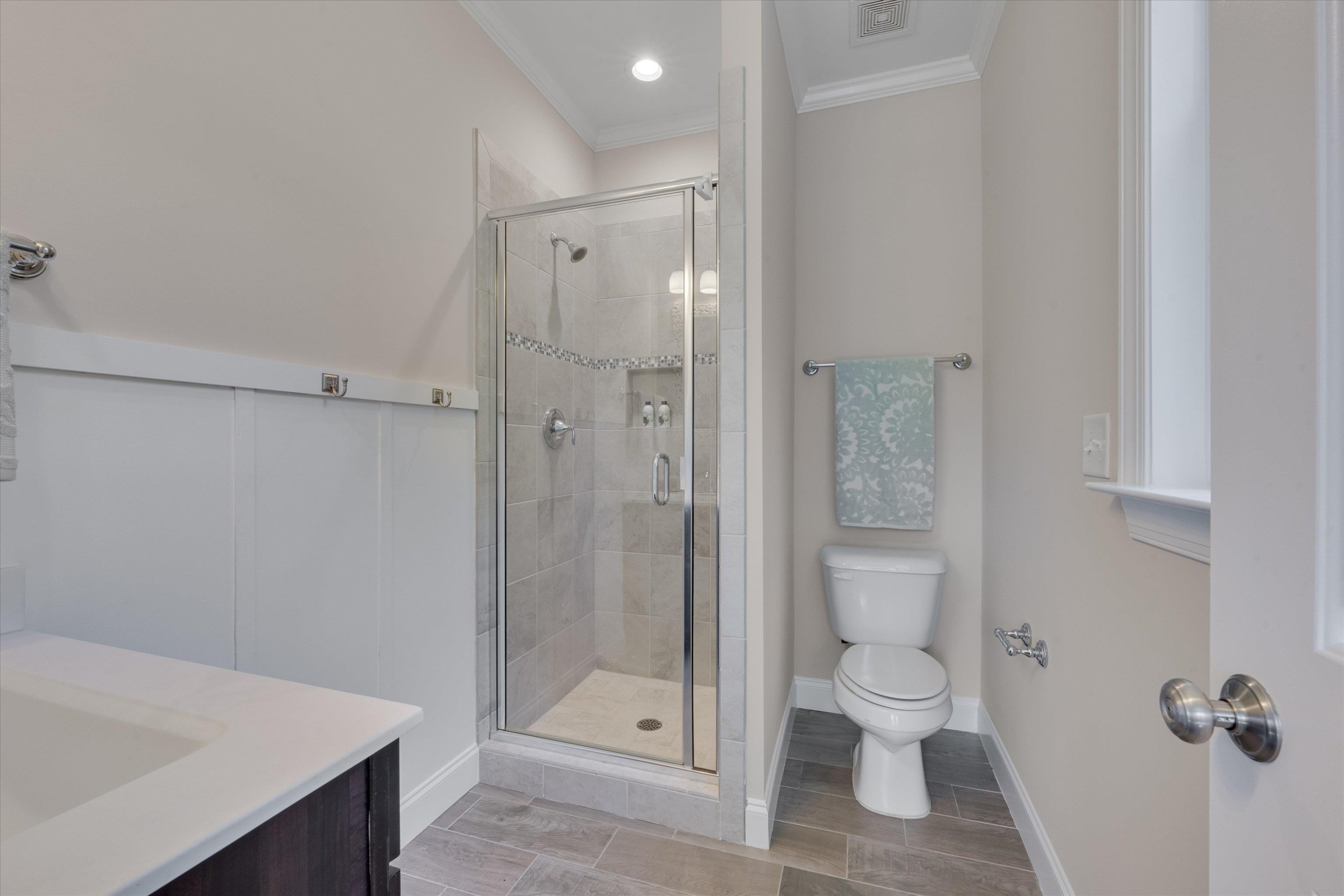 2617 Needle Pine Drive Apex, NC 27539 - Photo 15 of 42 a bathroom with a shower toilet and sink