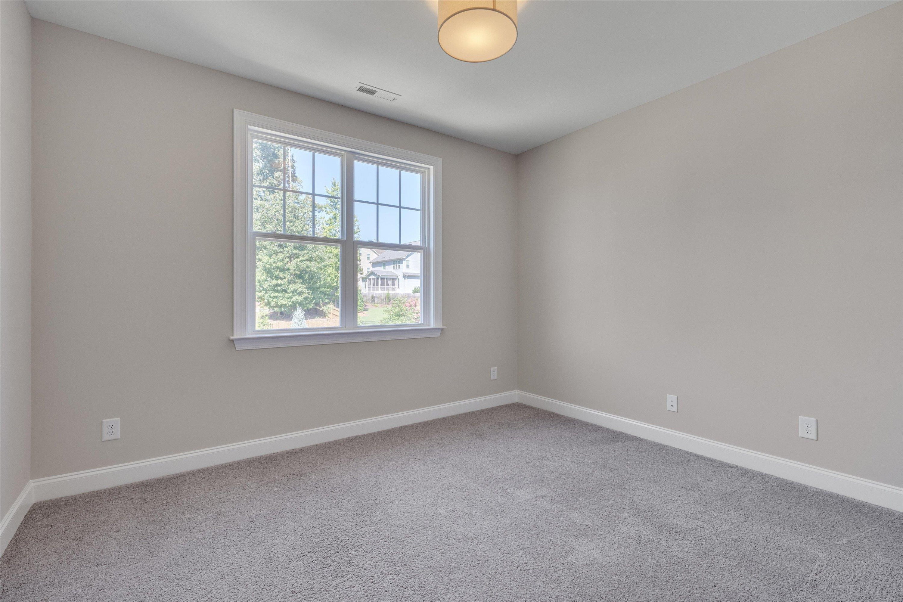 2617 Needle Pine Drive Apex, NC 27539 - Photo 22 of 42 an empty room with a window