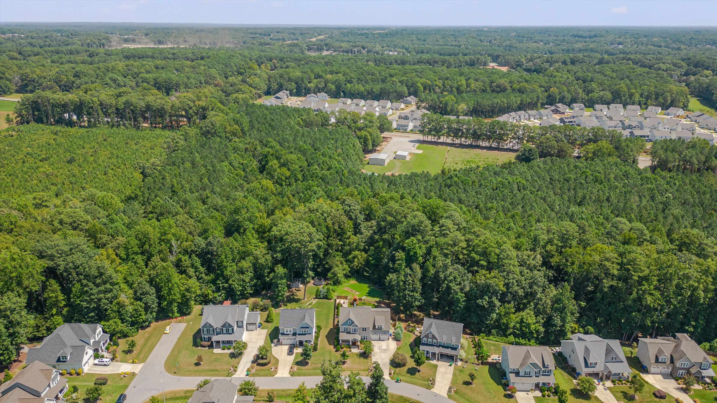 2617 Needle Pine Drive Apex, NC 27539 - Photo 40 of 42 a view of a lake with houses