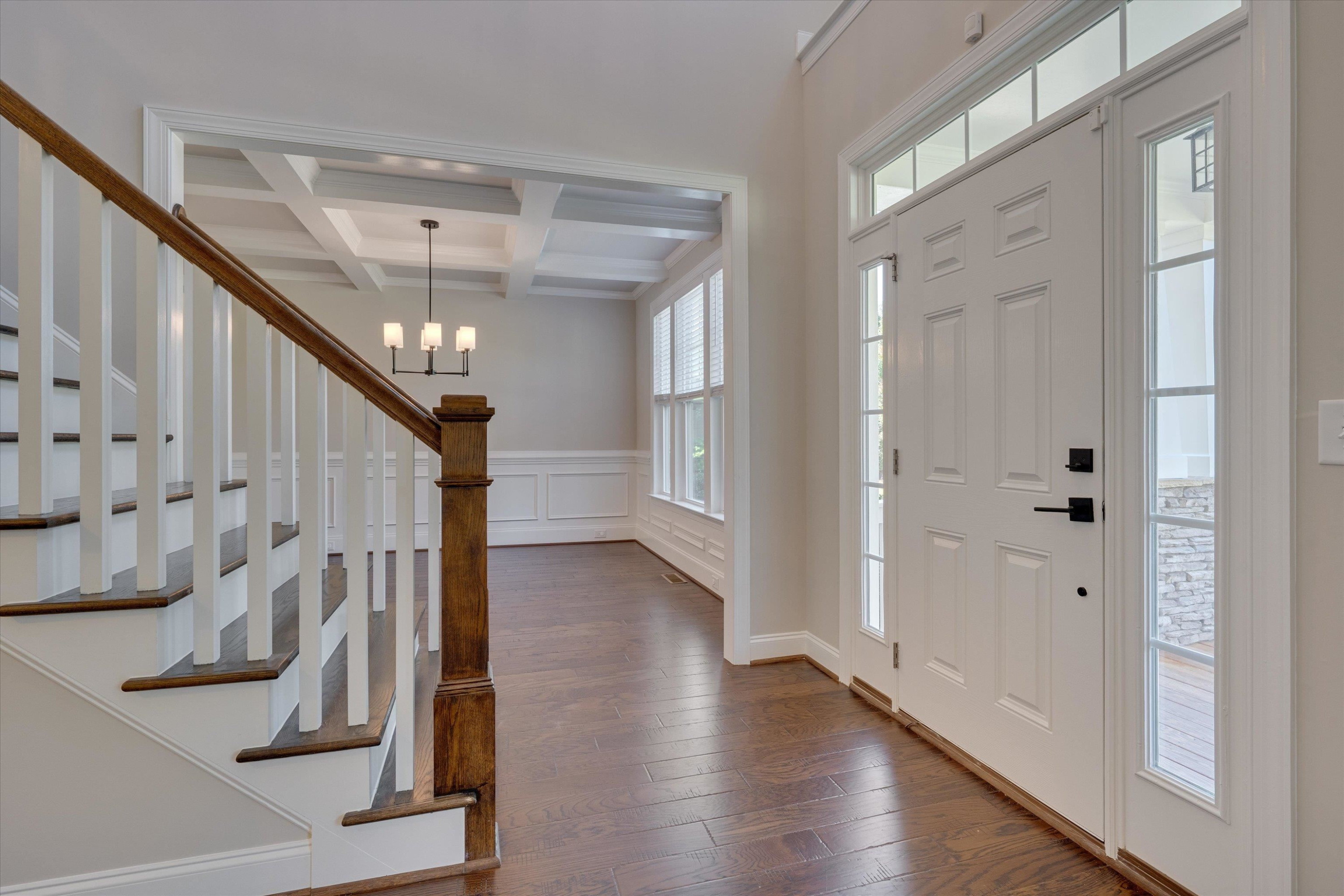 2617 Needle Pine Drive Apex, NC 27539 - Photo 7 of 42 a view of entryway with stairs and wooden floor