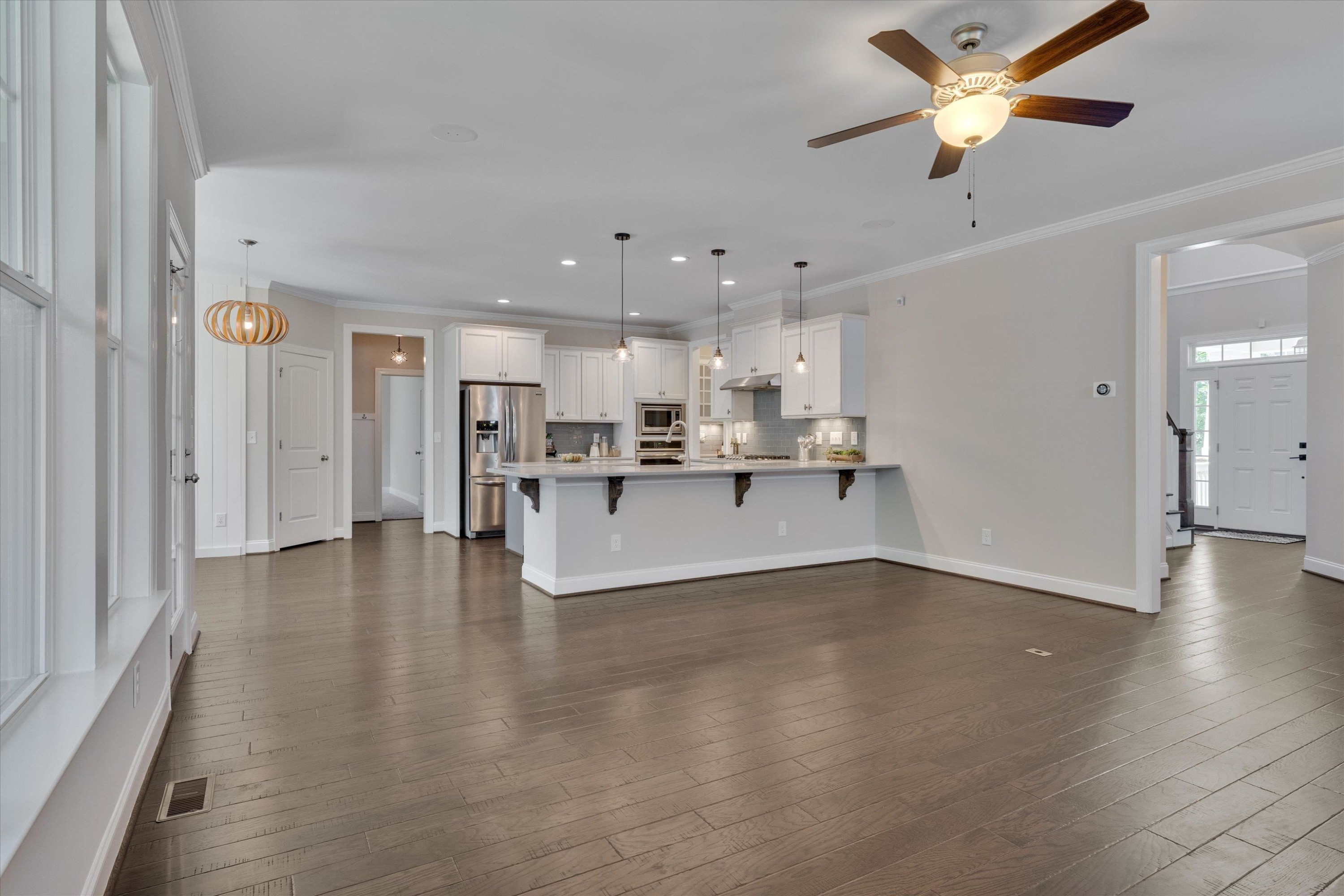 2617 Needle Pine Drive Apex, NC 27539 - Photo 10 of 42 a view of kitchen with wooden floor and a refrigerator