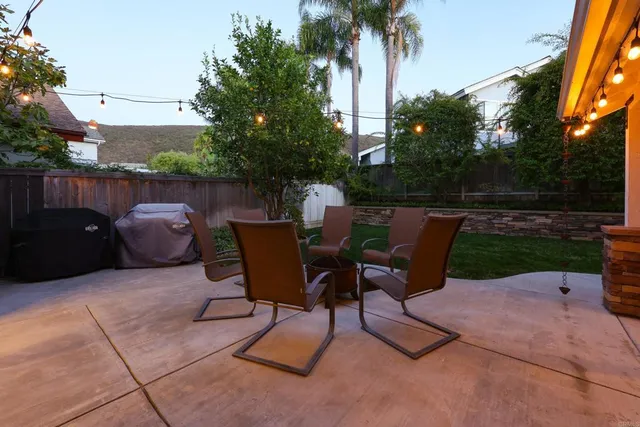a view of a workspace with furniture and a backyard
