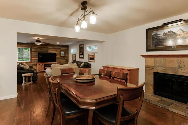 a view of a dining room with furniture wooden floor and a chandelier