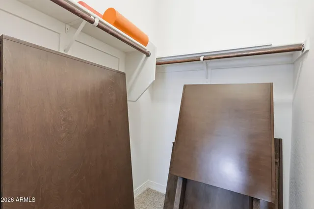 a spacious bathroom with a tub sink and mirror