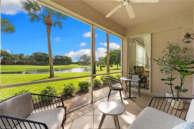 a living room with furniture and a garden