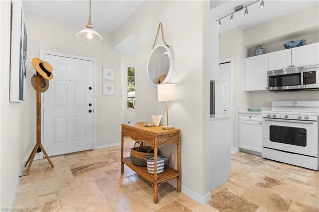 a view of kitchen with livingroom and fireplace