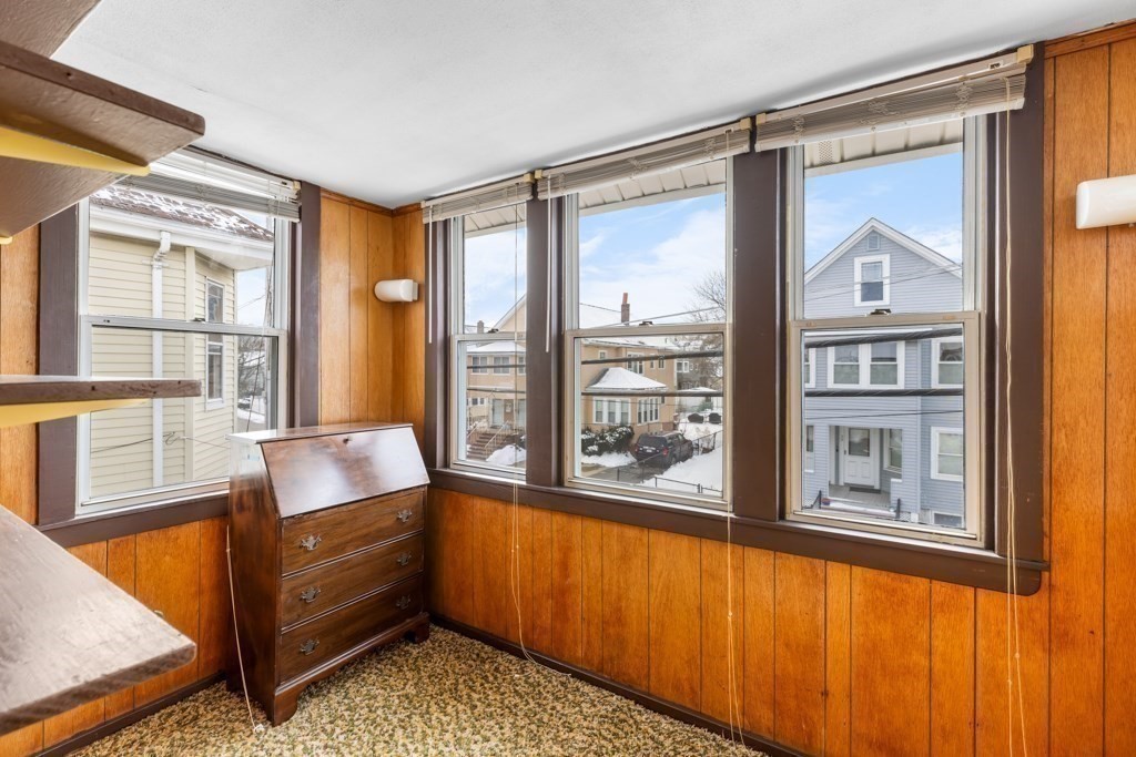 64 Maple Street Belmont, MA 02478 - Photo 11 of 22 a living room filled with furniture and a window