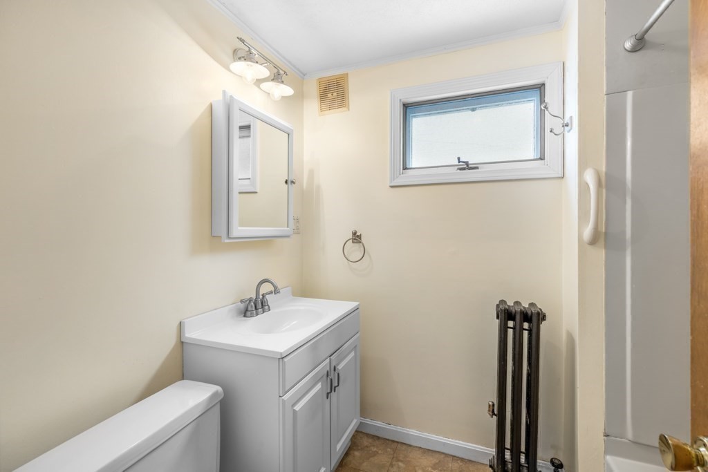 64 Maple Street Belmont, MA 02478 - Photo 17 of 22 a bathroom with a sink a toilet and shower