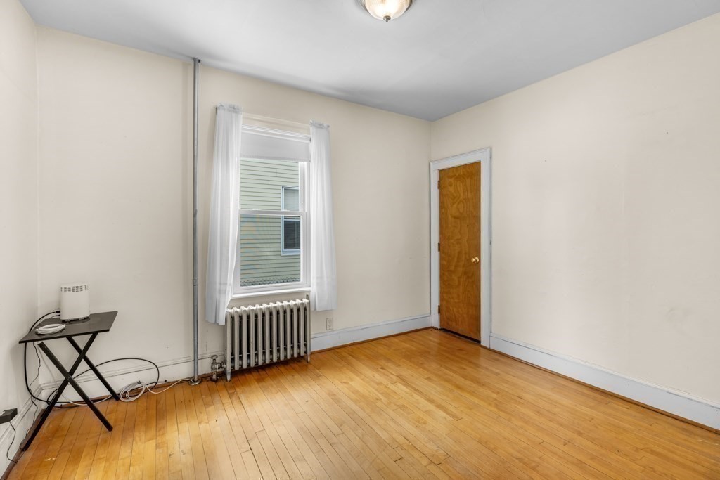 64 Maple Street Belmont, MA 02478 - Photo 18 of 22 an empty room with windows