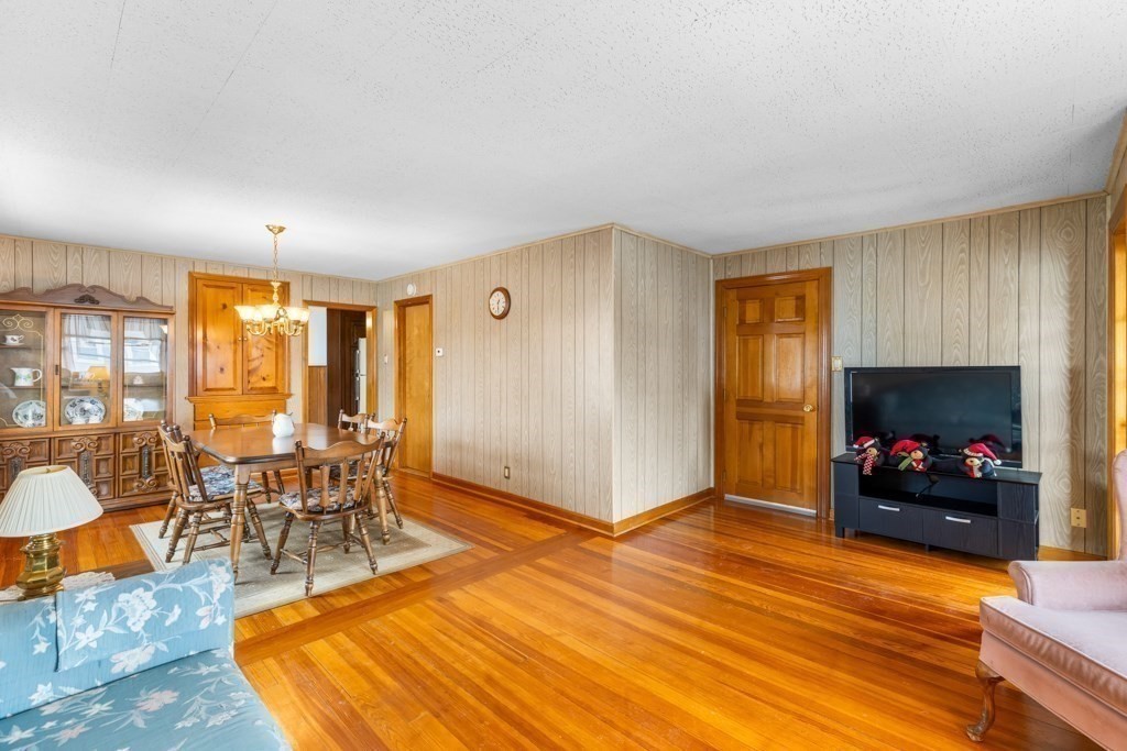 64 Maple Street Belmont, MA 02478 - Photo 5 of 22 a living room with furniture and a fireplace