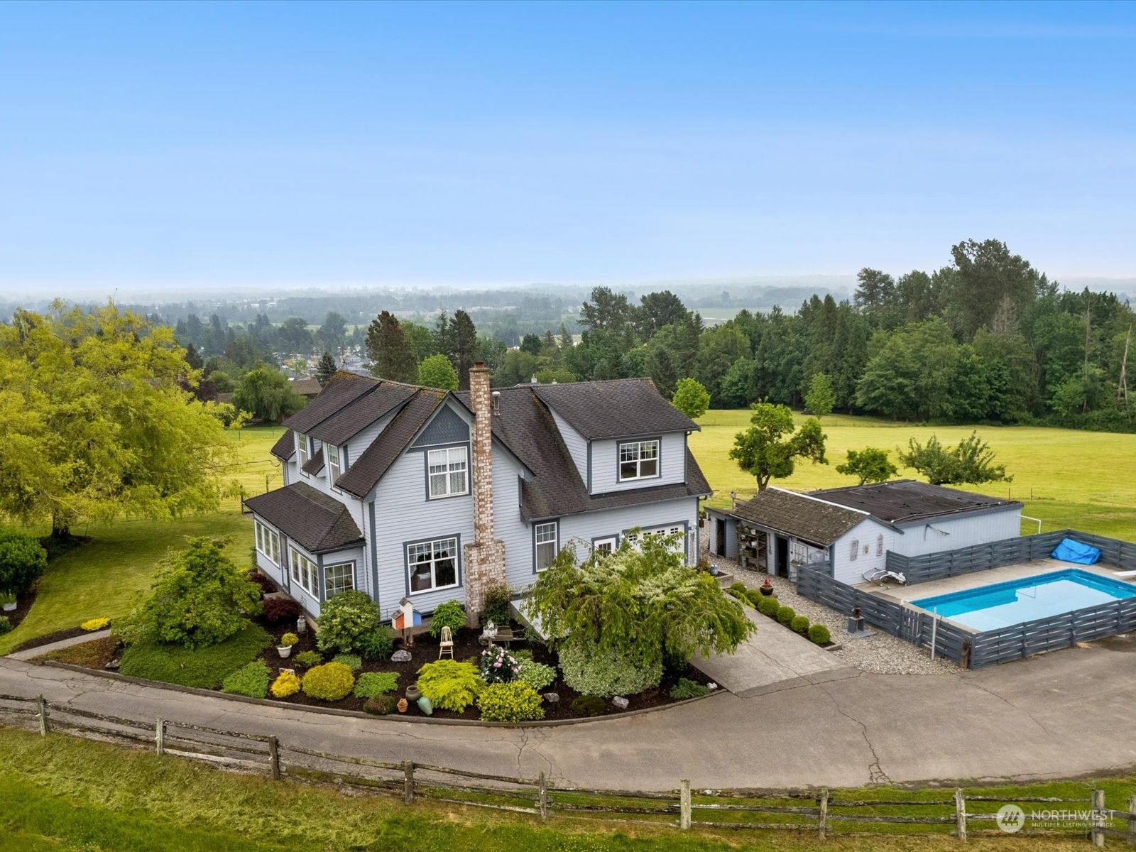 2625 Mountain View Road Ferndale, WA 98248 - Photo 1 of 40 an aerial view of a house with a garden and lake view