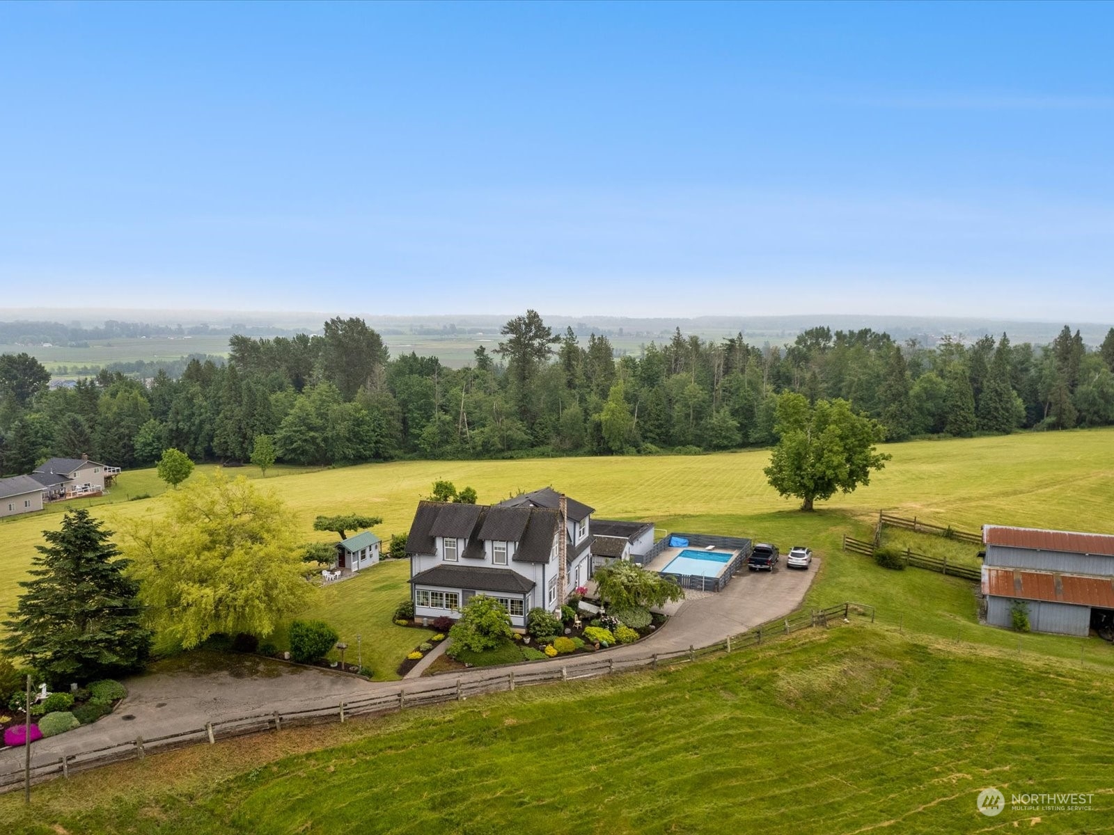 2625 Mountain View Road Ferndale, WA 98248 - Photo 5 of 40 a view of a swimming pool with a yard