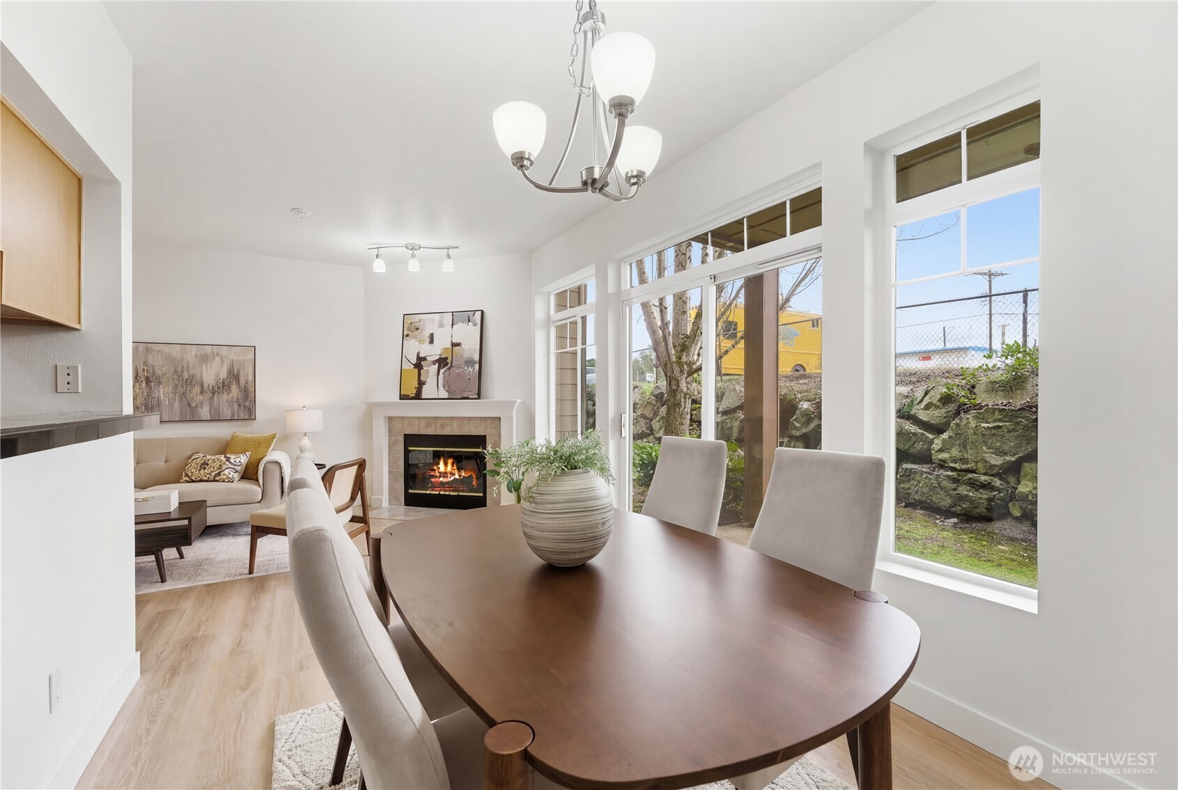 18930 Bothell Everett Highway, Unit G105 Bothell, WA 98012 - Photo 11 of 21 a view of a dining room with furniture window and wooden floor