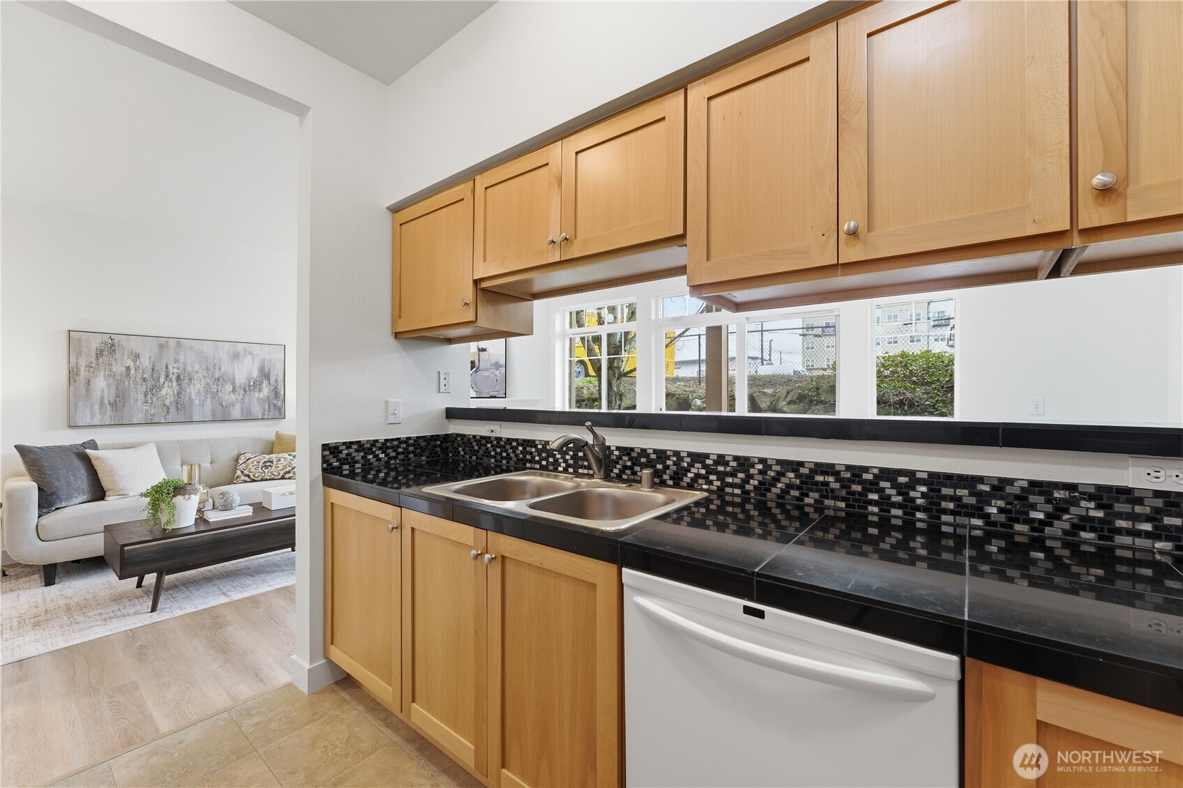 18930 Bothell Everett Highway, Unit G105 Bothell, WA 98012 - Photo 14 of 21 a kitchen with granite countertop a sink and a stove