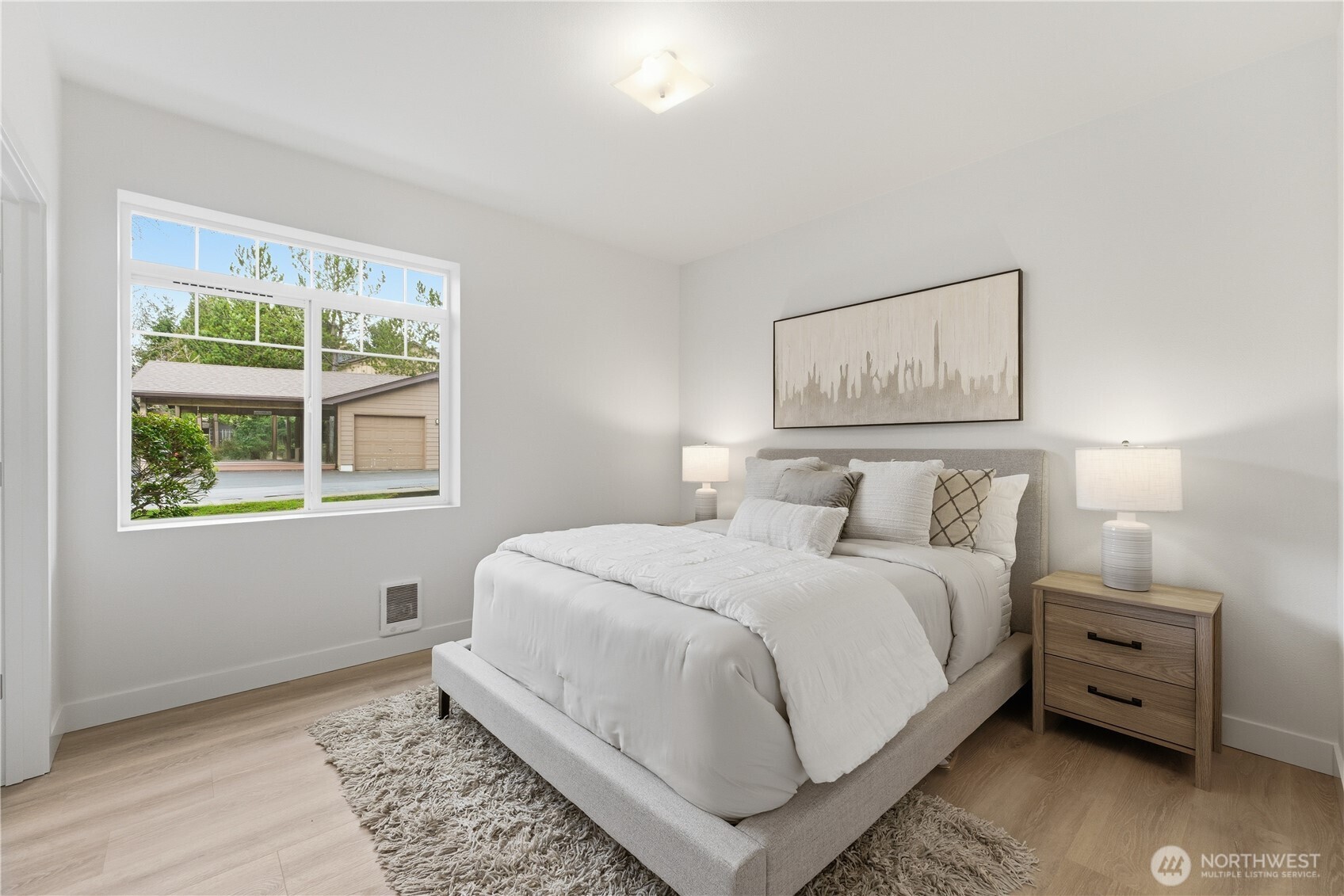 18930 Bothell Everett Highway, Unit G105 Bothell, WA 98012 - Photo 18 of 21 a bedroom with a bed and a window