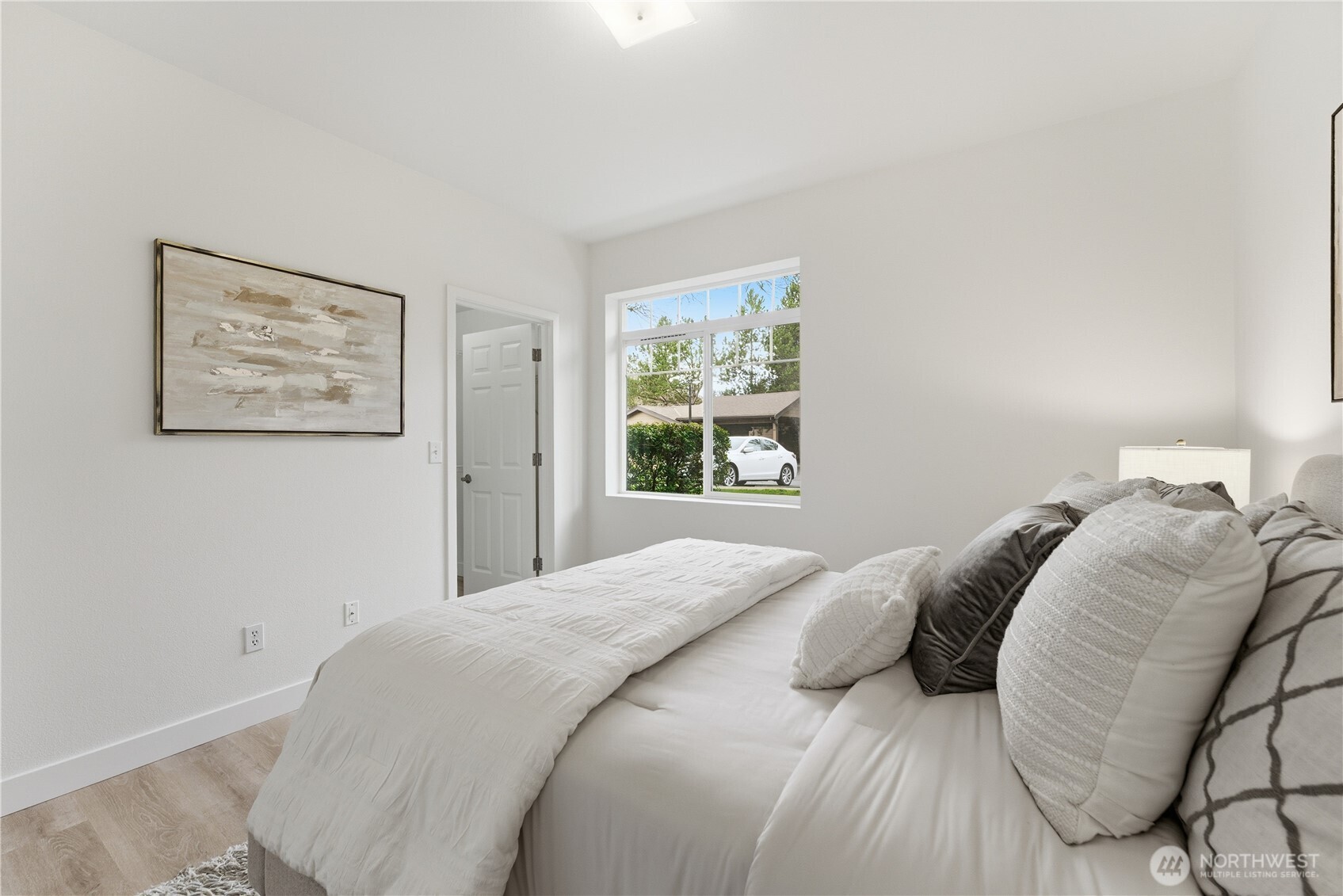 18930 Bothell Everett Highway, Unit G105 Bothell, WA 98012 - Photo 19 of 21 a bedroom with a bed and a window