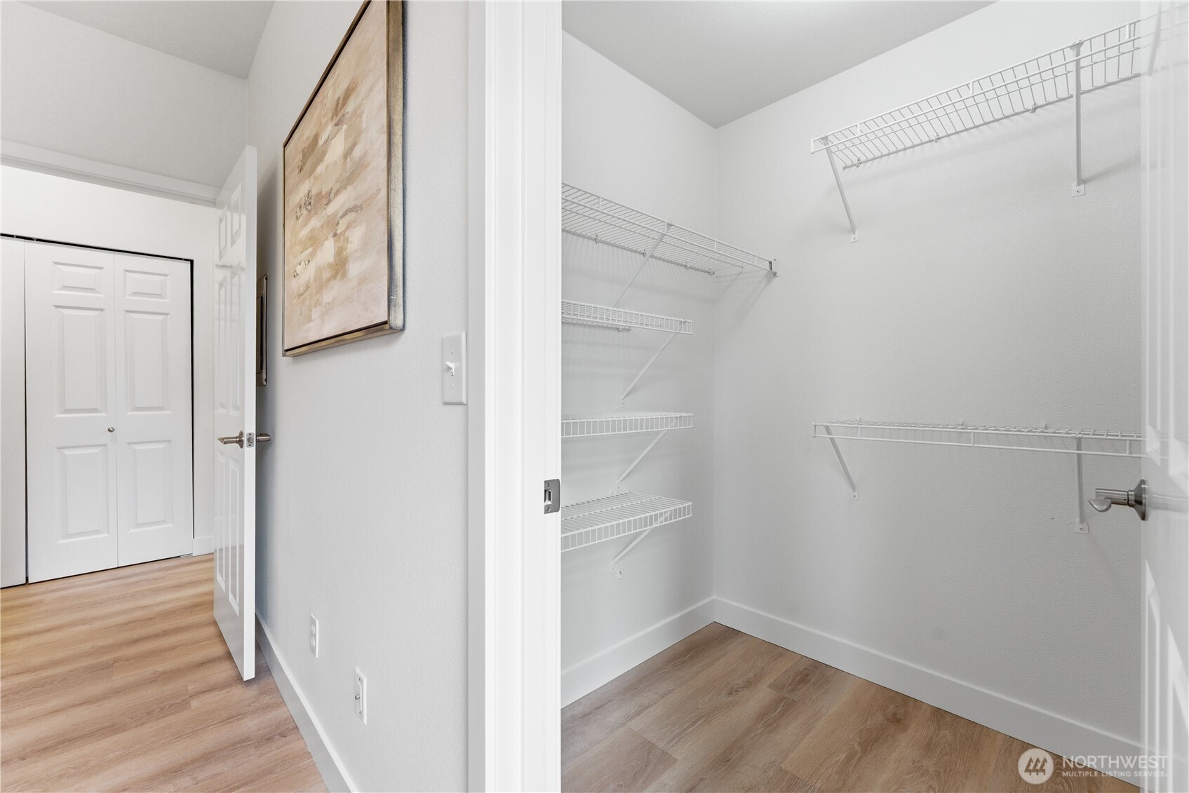 18930 Bothell Everett Highway, Unit G105 Bothell, WA 98012 - Photo 20 of 21 a view of hallway with wooden floor