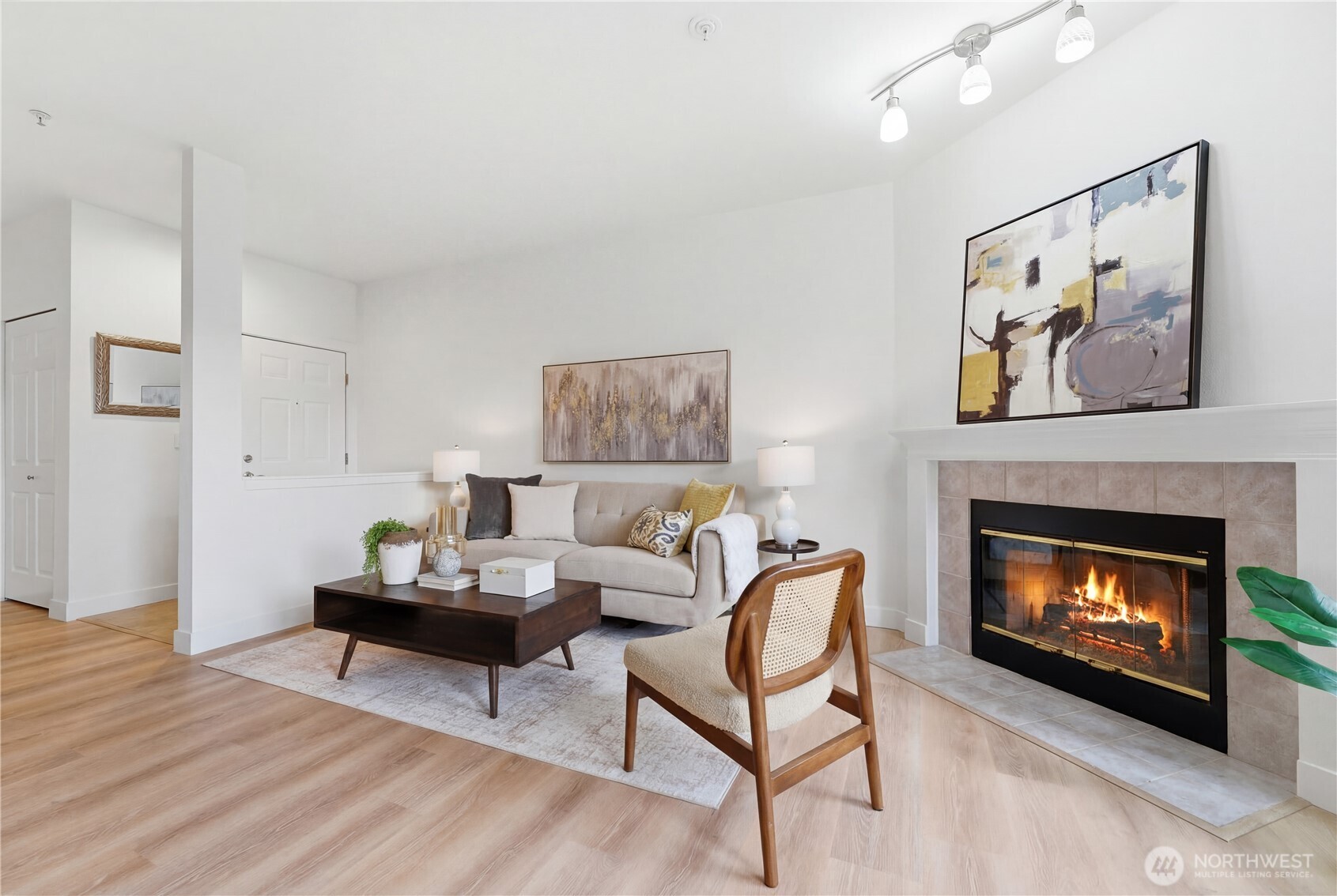 18930 Bothell Everett Highway, Unit G105 Bothell, WA 98012 - Photo 8 of 21 a living room with furniture and a fireplace