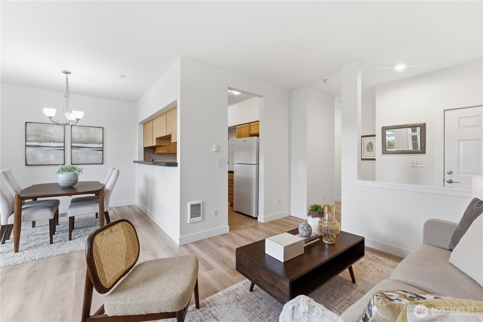 18930 Bothell Everett Highway, Unit G105 Bothell, WA 98012 - Photo 9 of 21 a living room with furniture and a window
