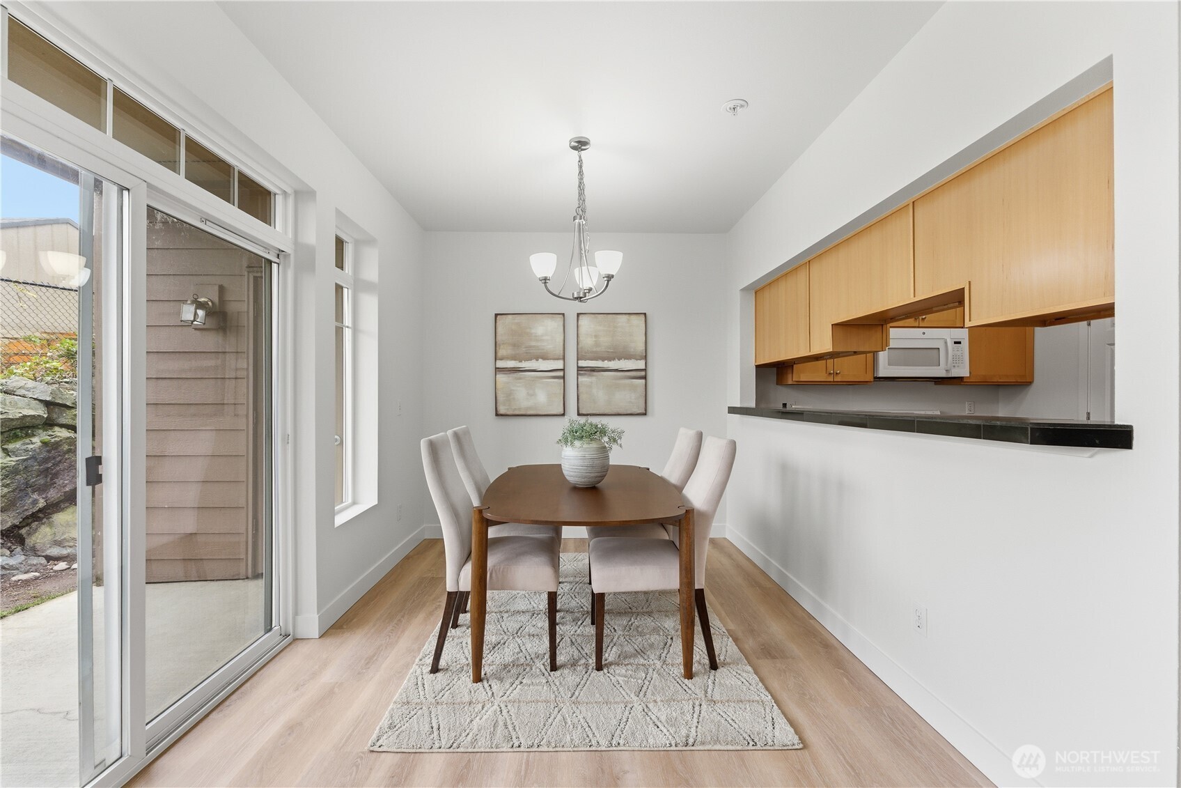 18930 Bothell Everett Highway, Unit G105 Bothell, WA 98012 - Photo 10 of 21 a dining room with furniture and window