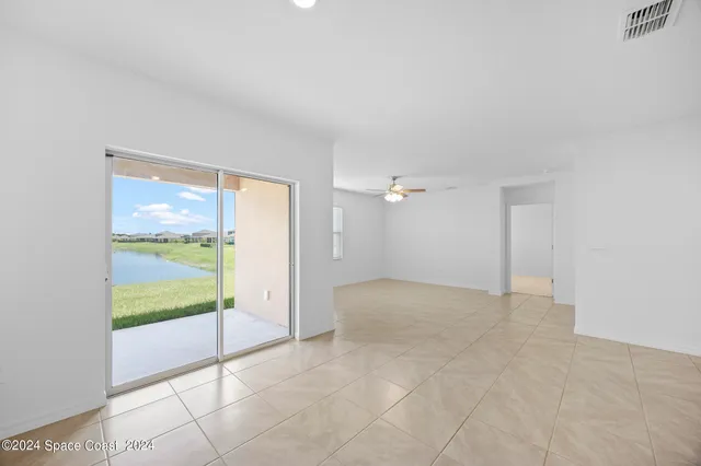 a view of an empty room and glass door