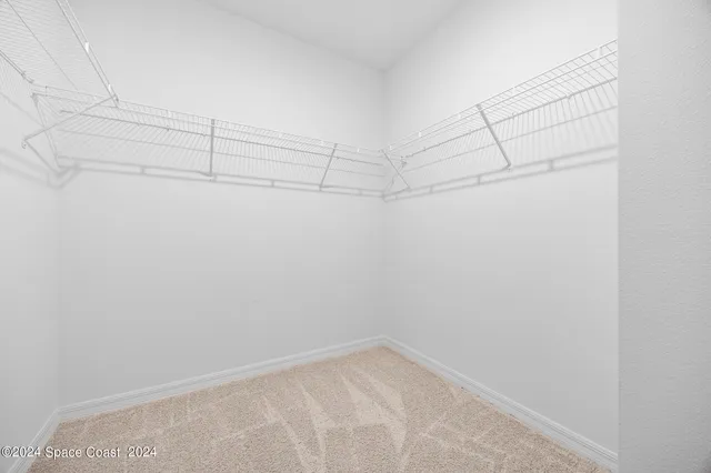 a view of a room with racks on the wall