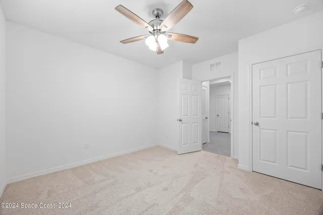 a view of a livingroom with a ceiling fan
