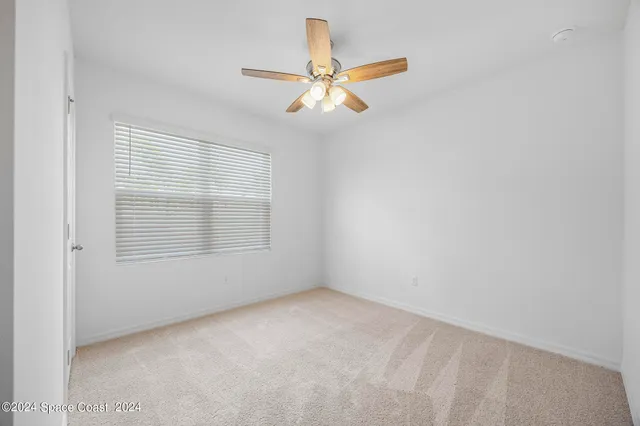 a bathroom with a sink a toilet and shower curtain