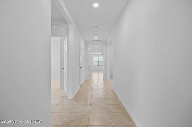 a view of a hallway with a white walls