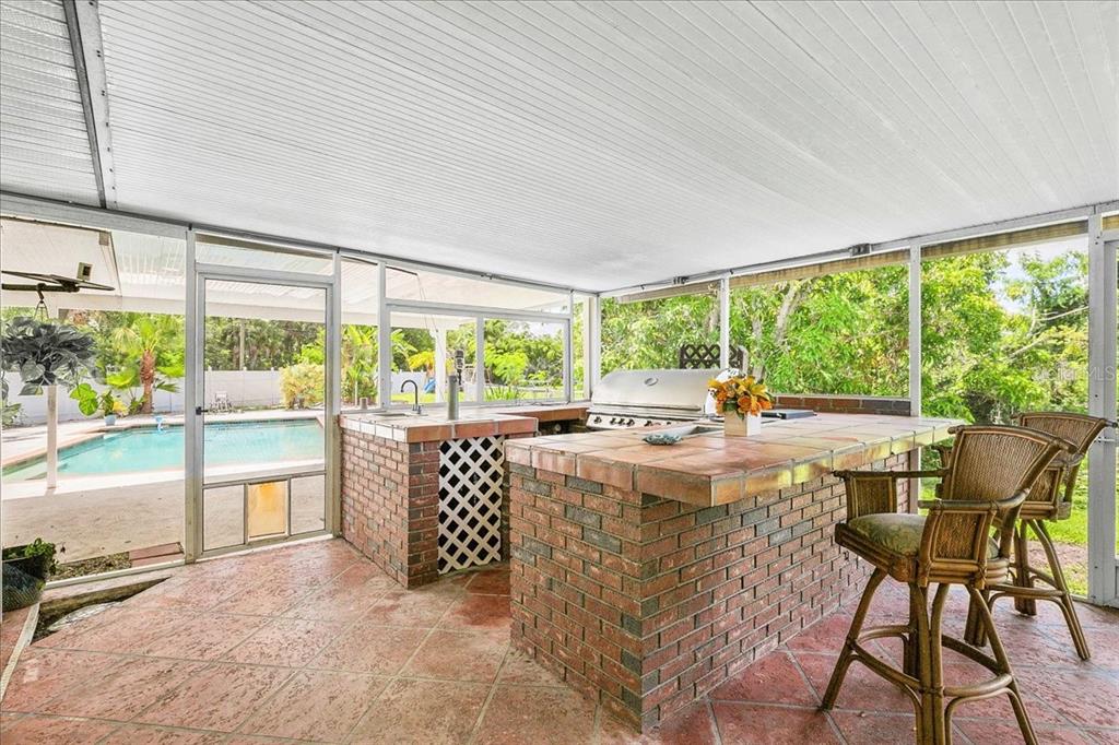 1302 Georgetowne Circle Sarasota, FL 34232 - Photo 21 of 28 a living room with furniture and large windows