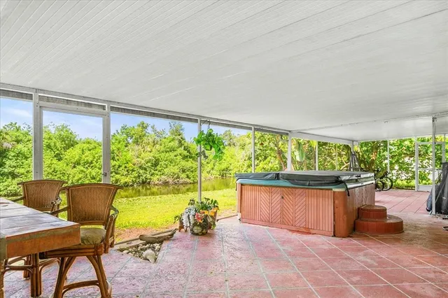 a view of backyard with seating area and green space