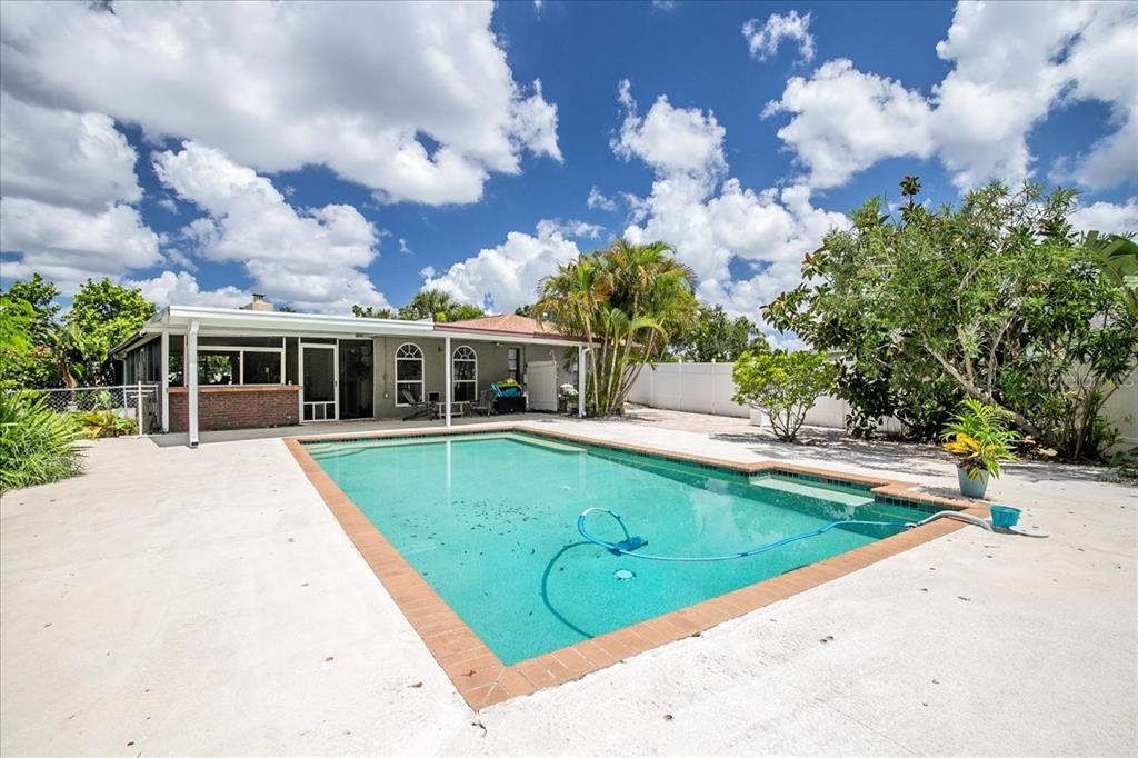 1302 Georgetowne Circle Sarasota, FL 34232 - Photo 24 of 28 a view of outdoor space yard and swimming pool
