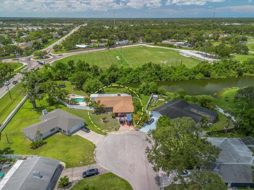 1302 Georgetowne Circle Sarasota, FL 34232 - Photo 26 of 28 a view of a city with a lake