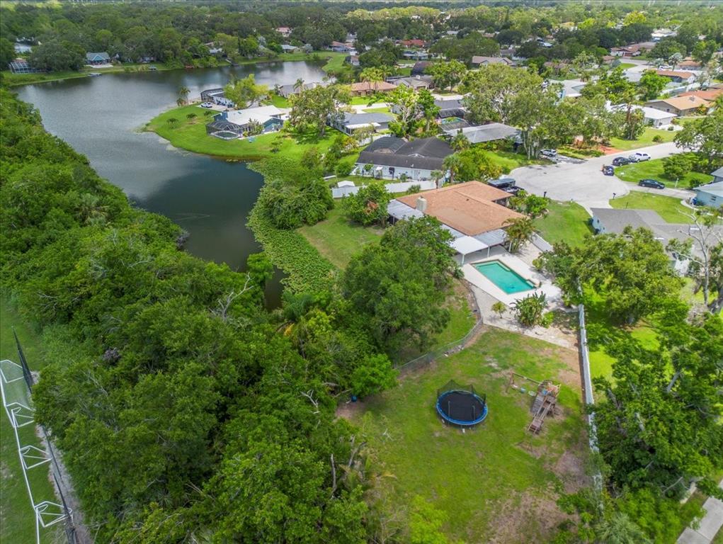 1302 Georgetowne Circle Sarasota, FL 34232 - Photo 27 of 28 an aerial view of residential house with outdoor space and lake view
