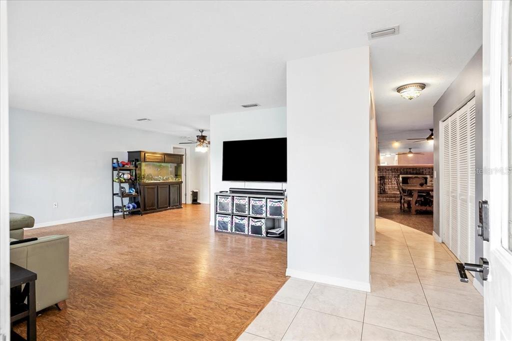 1302 Georgetowne Circle Sarasota, FL 34232 - Photo 4 of 28 a view of a livingroom with furniture and a flat screen tv