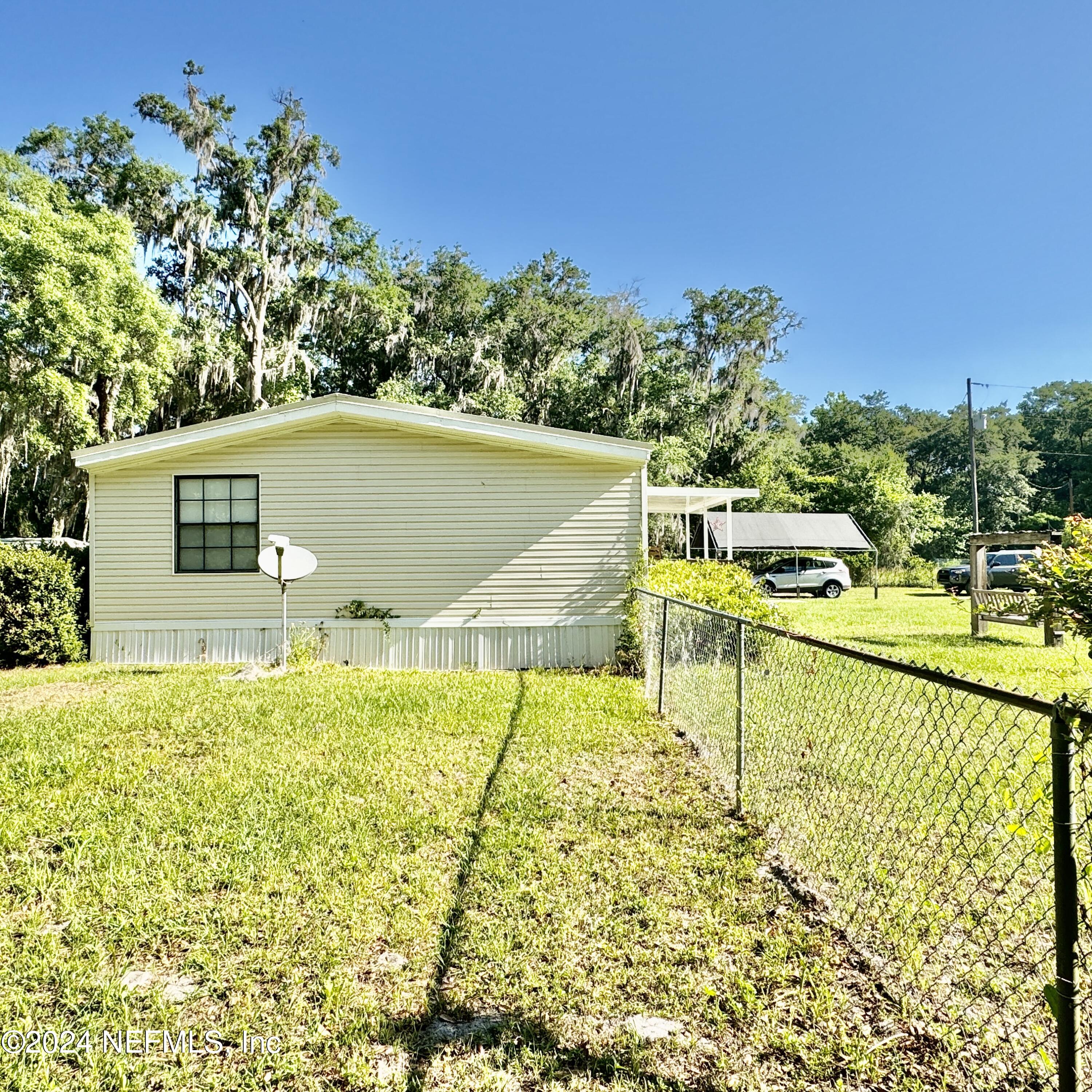 105 George Avenue Interlachen, FL 32148 - Photo 11 of 29 a view of a swimming pool with a patio