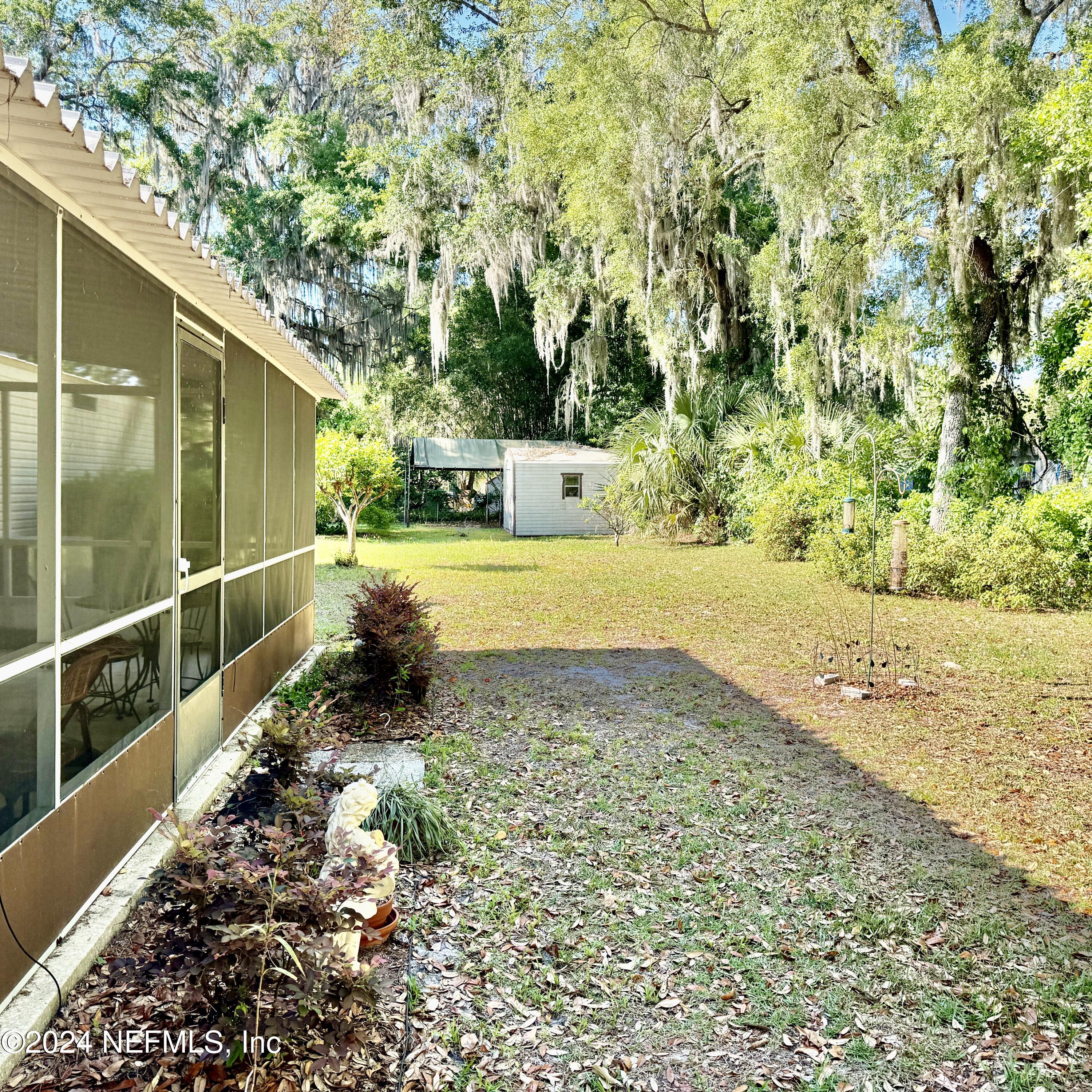 105 George Avenue Interlachen, FL 32148 - Photo 13 of 29 a view of a backyard