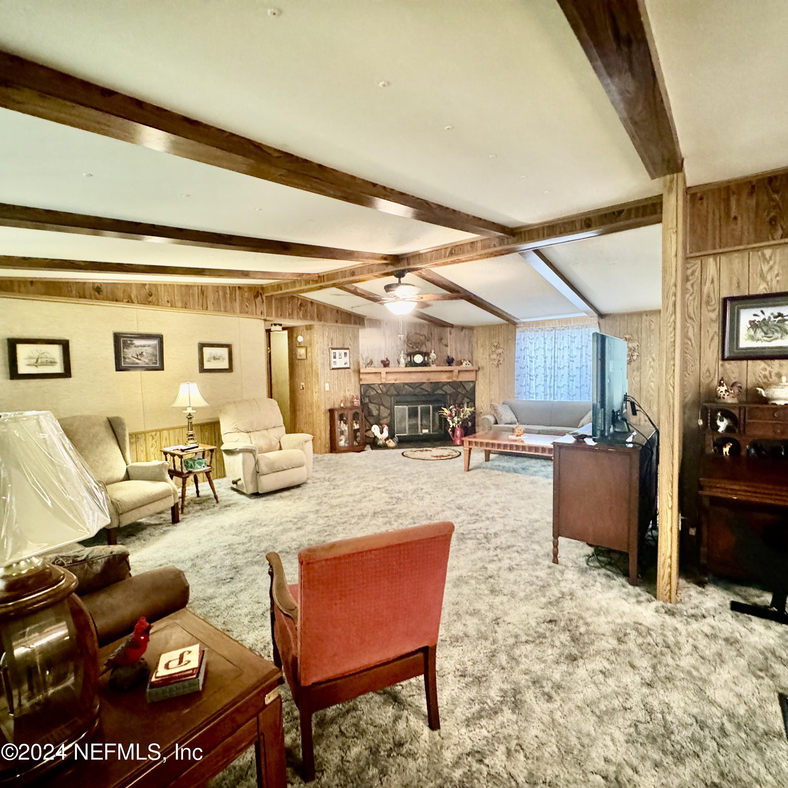 105 George Avenue Interlachen, FL 32148 - Photo 16 of 29 a living room with furniture and a wooden floor