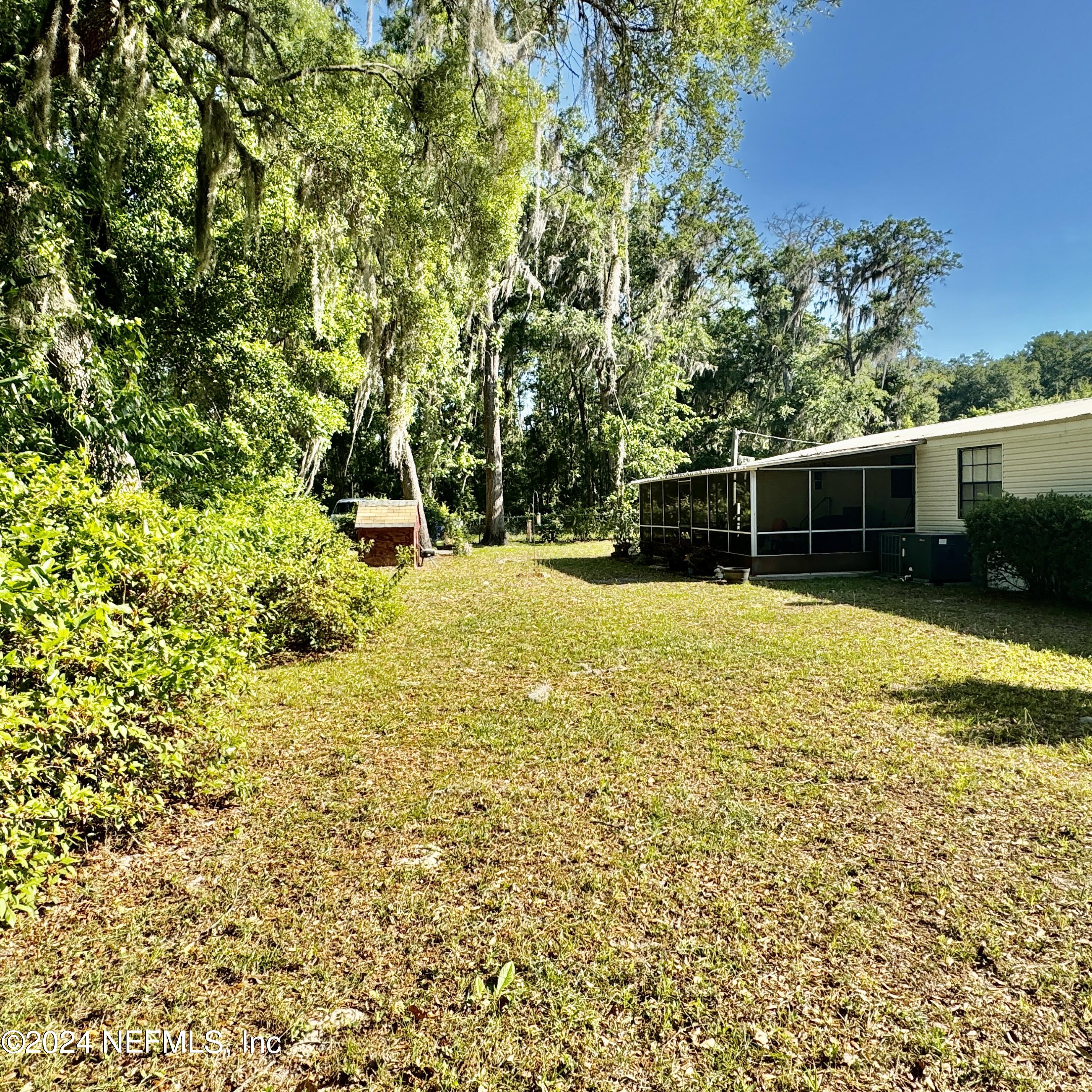 105 George Avenue Interlachen, FL 32148 - Photo 9 of 29 a view of a backyard