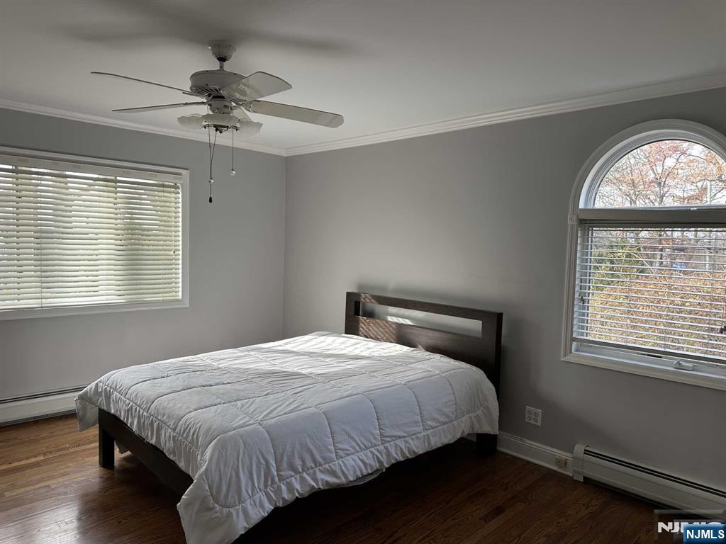 711 Camperdown Road Teaneck, NJ 07666 - Photo 12 of 12 a bedroom with a bed and a window