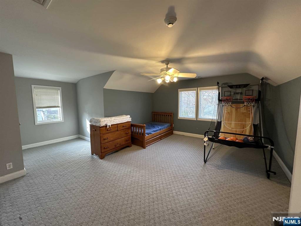 711 Camperdown Road Teaneck, NJ 07666 - Photo 4 of 12 a room with pool table and windows