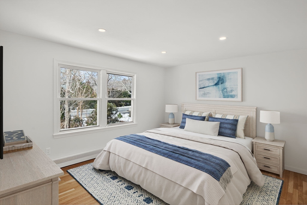 585 Old Falmouth Road Barnstable, MA 02648 - Photo 16 of 40 a bedroom with a large bed and a window